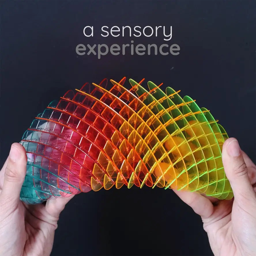 Two hands bend the Big Rainbow Morf Fidget Worm.