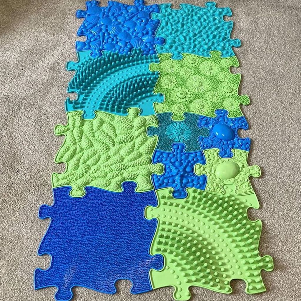 The 11 pieces of the Ocean Sensory Playmat Set.