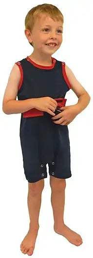 A child wearing Kozie Medical and G-Tube One-Piece Shorts - The Nathan.