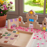 The 21 Piece Natural Wooden Architectural Building Block Set shaped into a castle with lucite blocks.