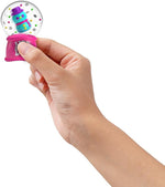 A hand squeezes the base of a Snowman Squishmas Squish'n Snow Globe.