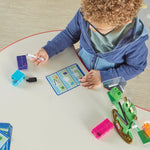A child fills out one of the Double Sided Playing Cards with the Dry Erase Marker.