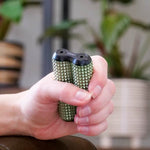 A hand rolls the Sage ONO Aluminum Acupressure Roller.