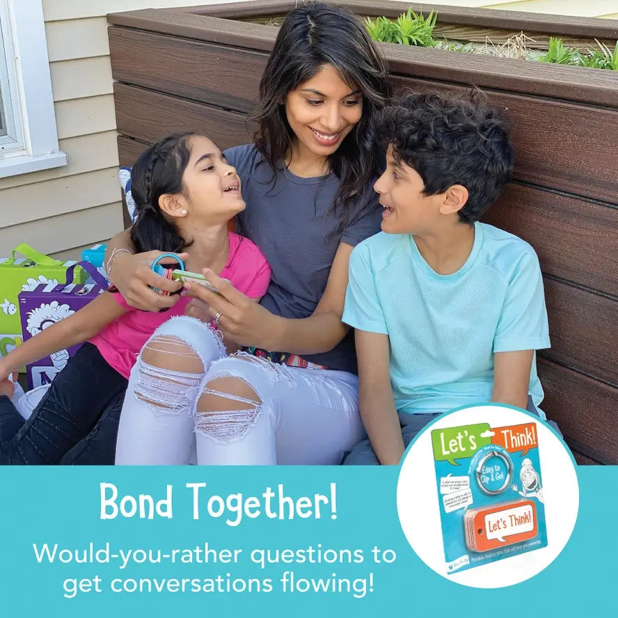 Two children with with an adult while holding the Let's Think Conversation Cards.