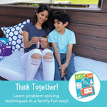 An adult and a child smile while flipping through the Let's Think Conversation Cards.