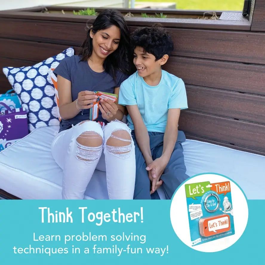 An adult and a child smile while flipping through the Let's Think Conversation Cards.