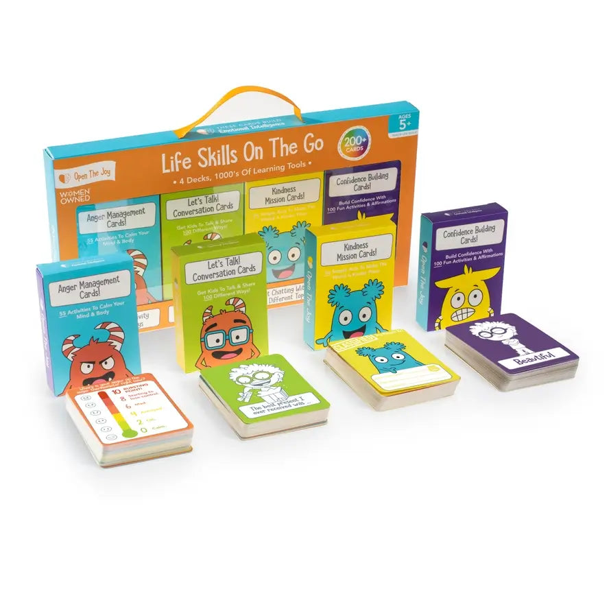 The four separate card decks in Life Skills on the Go are organized in front of their respective packaging.