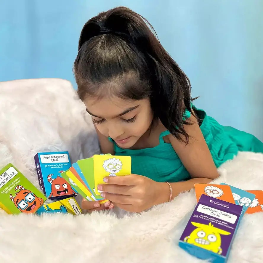 A child is looking at a mixture of the different decks in Life Skills on the Go.