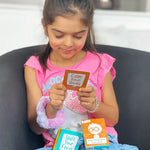 A child holds an orange Anger Management Tool Card and practices one of the Calm Your Body prompts.