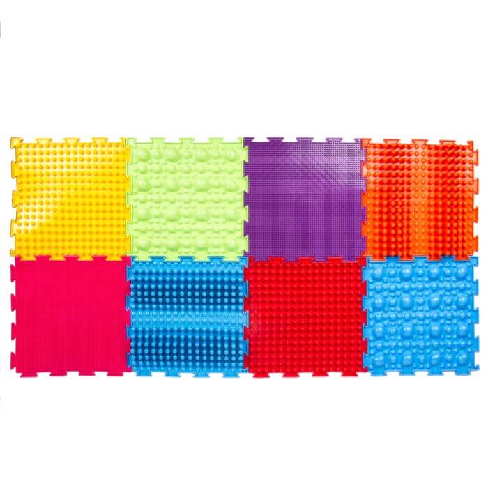 The 8 mats in the Rainbow Sensory Massage Puzzle set.
