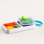 The PlayTab Go Travel Sensory Activity Board with the Gear tile popped out.