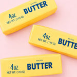 Three sticks of the Butter Me Up Slow Rise Squishy.