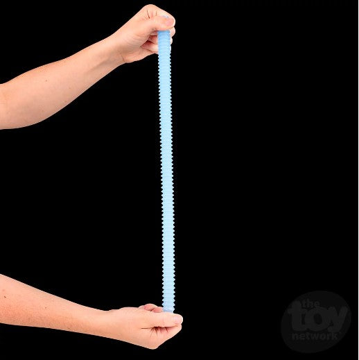 Two forearms disconnected from a torso out of the shot are pulling a Glow in the Dark Pop Tube to stretch it out. The panel is dark and the tube is glowing.