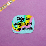 The Give it My Almost 3" Glittery Vinyl Sticker on a purple textured piece of paper.