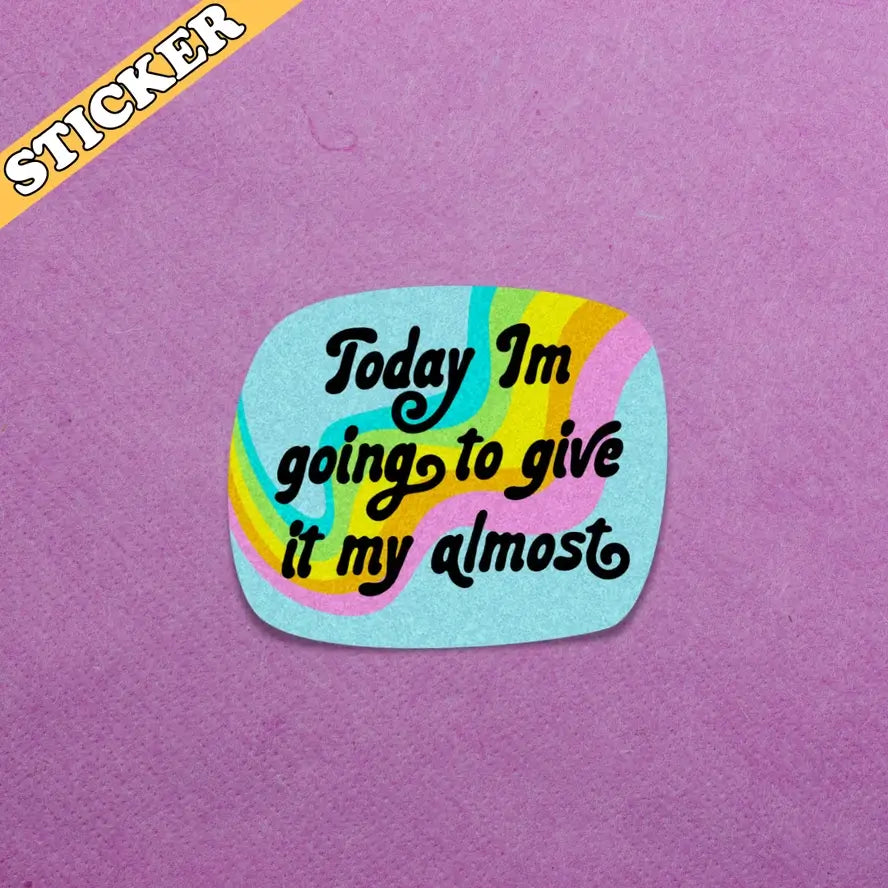 The Give it My Almost 3" Glittery Vinyl Sticker on a purple textured piece of paper.