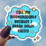 A hand holds up the blue Call Me Biodegradable Because I Break Down Easily 4" Vinyl Sticker.