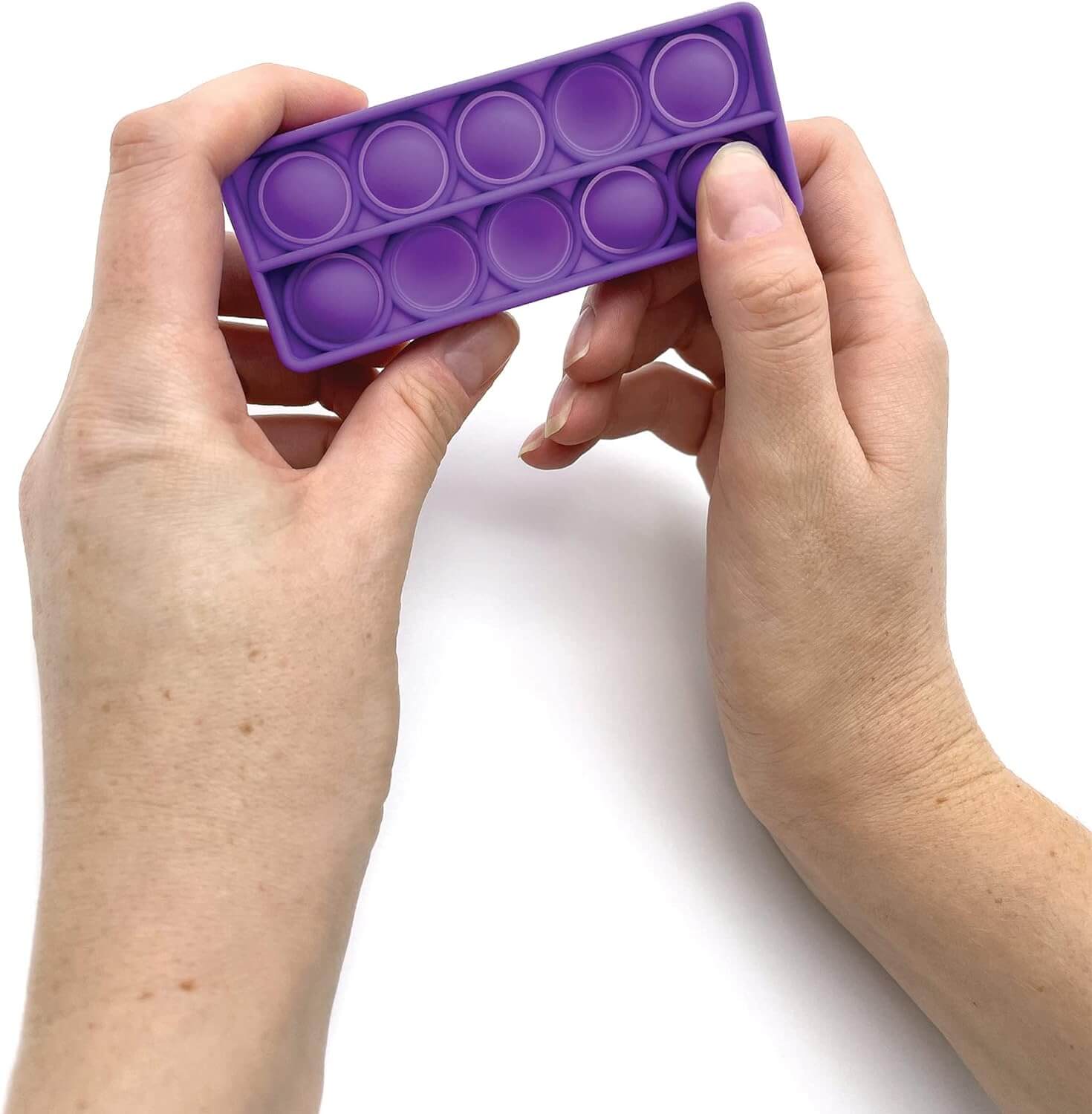 A hand holds up a purple Push and Pop Bubble Ten Frames.