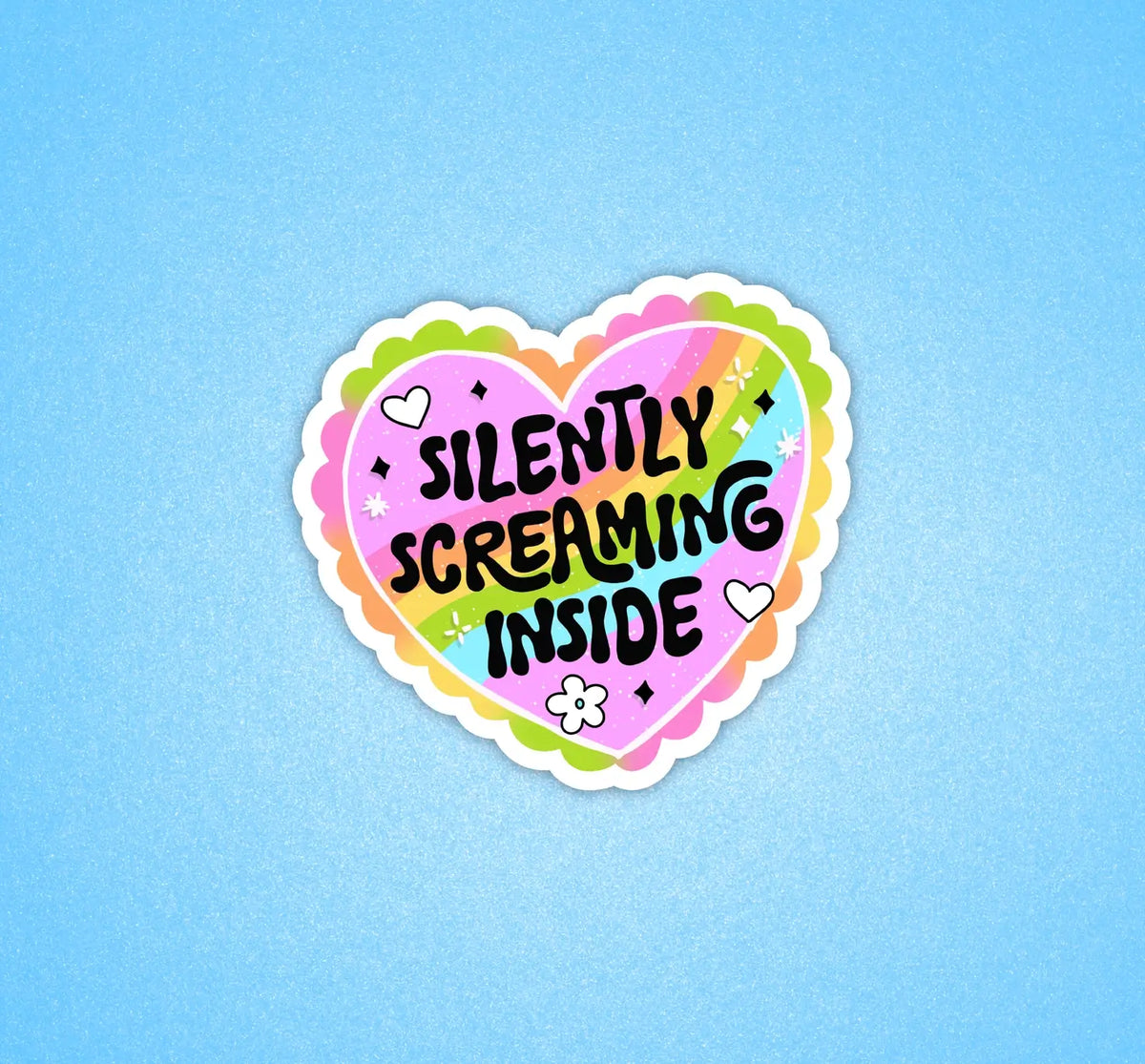 A heart shaped pastel sticker with black text that reads: Silently Screaming Inside.