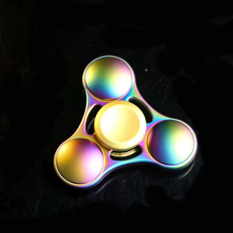The Rainbow Metal Fidget Spinner against a black background.