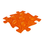 The orange dino eggs in the Rainbow Sensory Playmat Set.