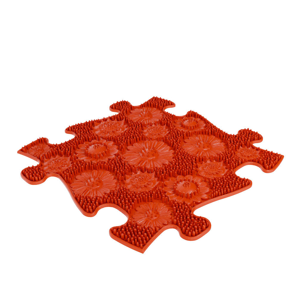 The red meadow mat in the Rainbow Sensory Playmat Set.