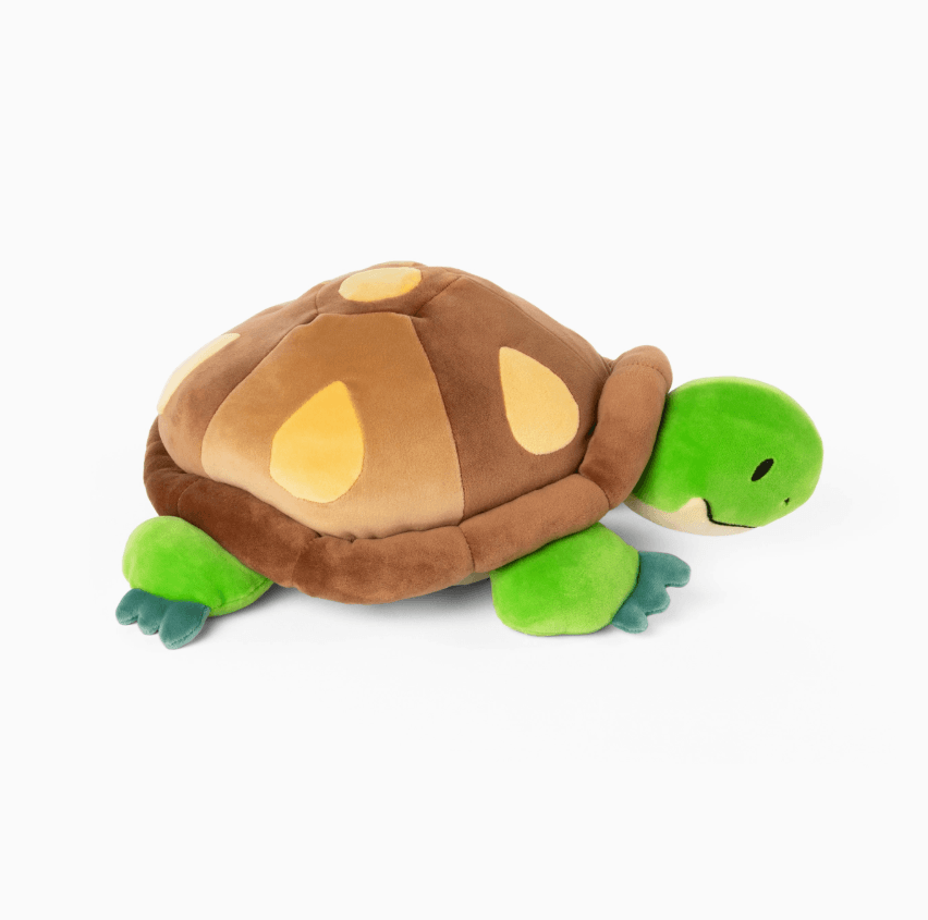 The side profile of the Weighted Turtle 3 lb Plush.