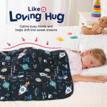 A child lays on her tummy and sleeps peacefully under the Rocket Weighted Cooling Lap Pad 2 lb.