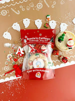 The product packaging for Santa's Cottage KidDough Plat Kit below a string of decorative white beards.