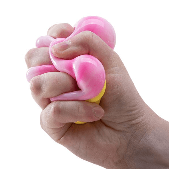 A hand squeezes the pink Nee Doh Nice Cream Cone.