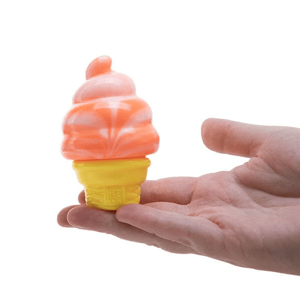 The orange Nee Doh Nice Cream Cone balancing on a hand.