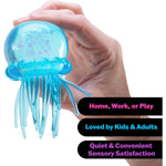 A hand holds the blue NeeDoh Jelly Squish.