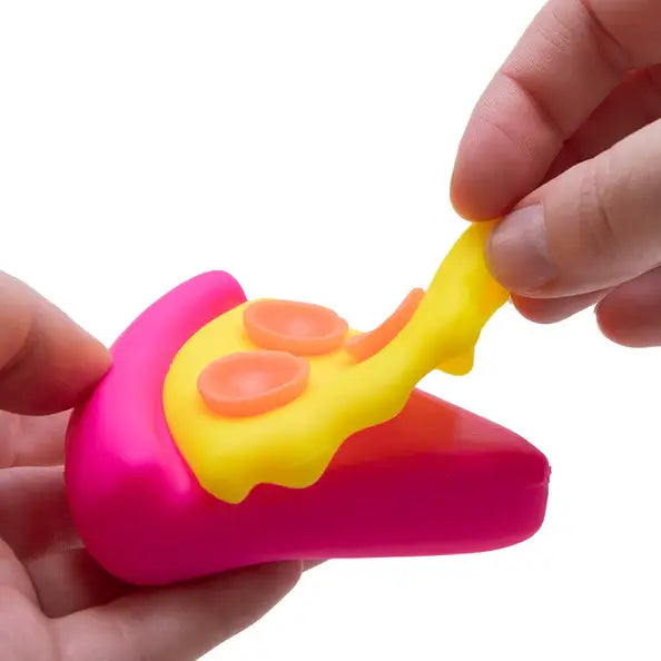 A hand peels back the cheese on the NeeDoh Squeezza.
