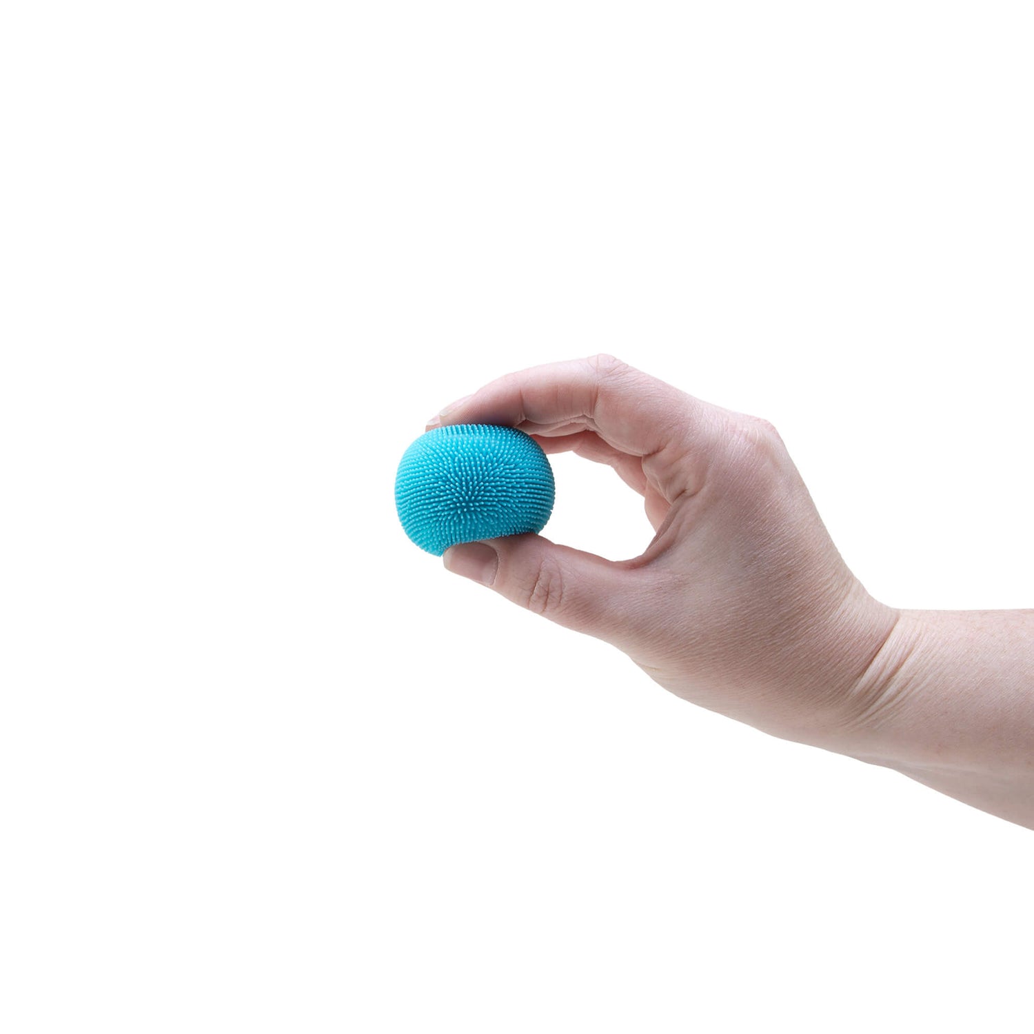 A hand holds a teal NeeDoh Teenie Fuzz Ball.