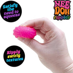 A hand squishes the ripple Teenie Fab Four NeeDoh.