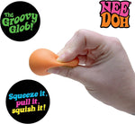 A hand squishes the original Teenie Quad Squad squish.