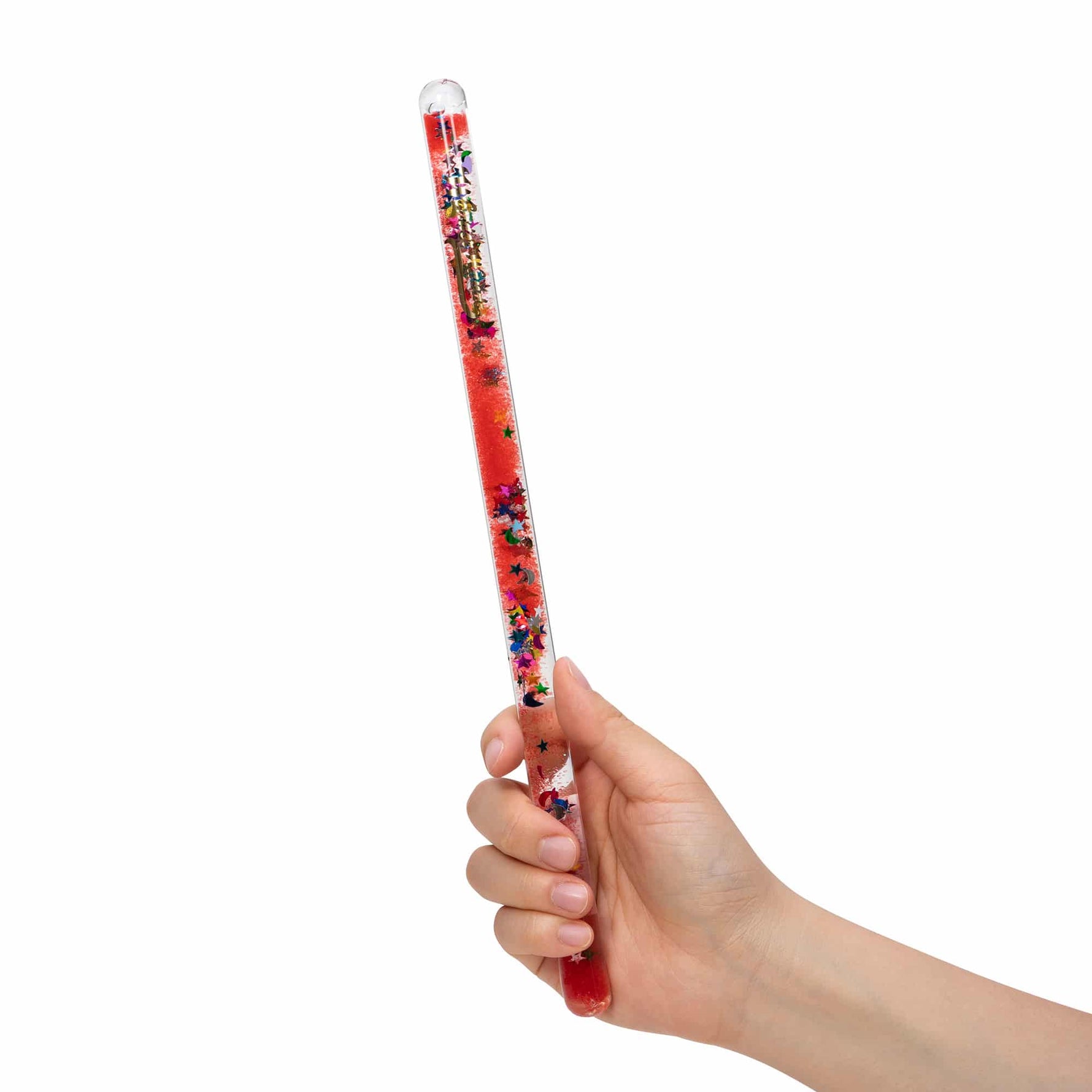 A hand holds the red Wonder Wand.