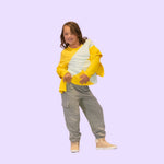 A child wears the grey Youth Sensory Friendly Fidget Jogger while posing.