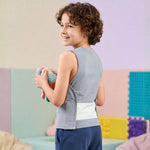 A child wears the Adjustable Compression Sensory Undershirt by Sense-ational You.