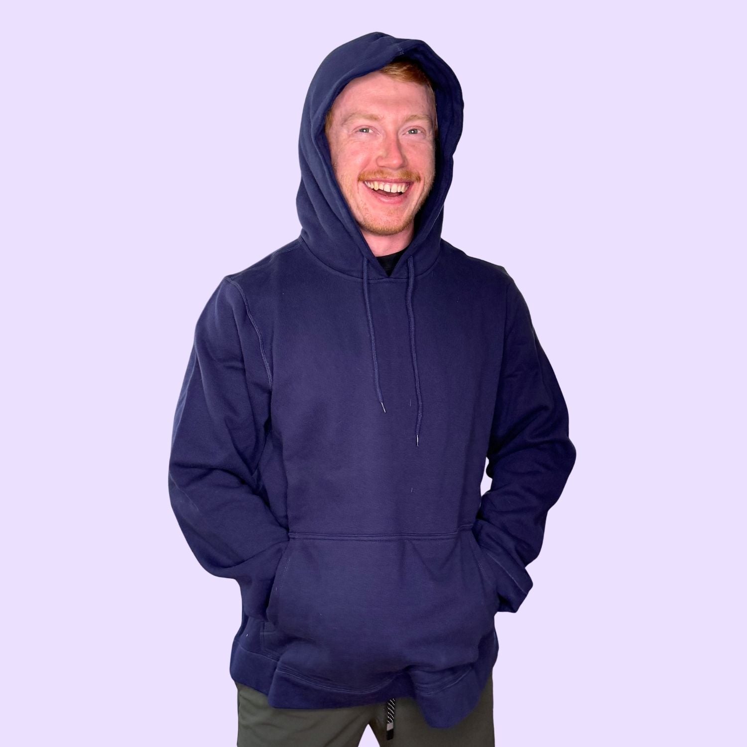 An adult wears the navy Adult Marble Maze Fidget Hoodie from Sense-ational You.