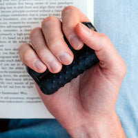 A hand holds the ONO Roller Silicone.