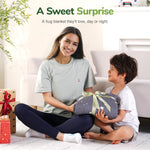 An adult hands the Space Grey Washable Cooling Weighted Blanket to a child.