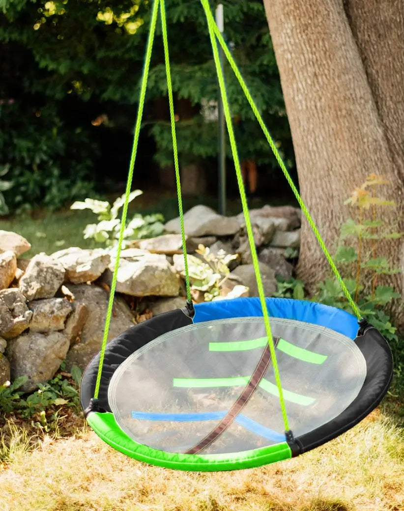 The 40" Adventure Sky Swing hanging from a tree.