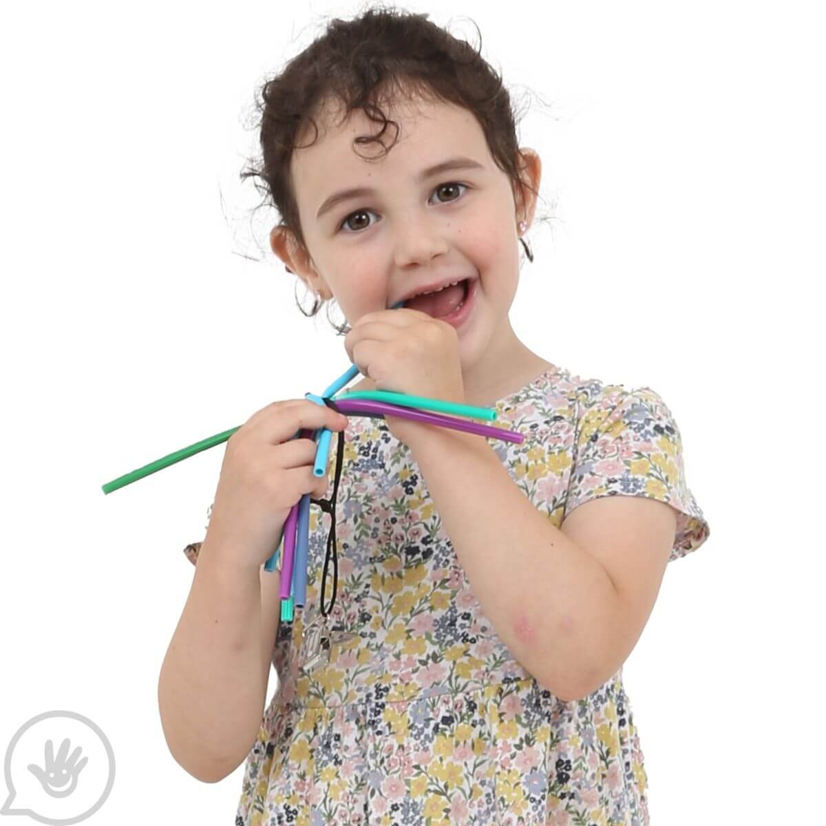 A child chews on the Spaghetti Chewy Fidget.