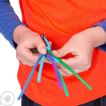 A child manipulates the Spaghetti Chewy Fidget with their hands.