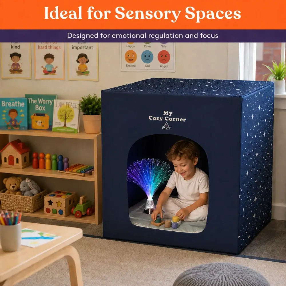 A child sits in the Special Supplies Blackout Sensory Tent in a classroom and uses the Fiber Optic LIght to play with blocks.