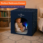 A child hugs their teddy bear while using My Cozy Corner in their bedroom.
