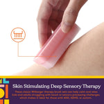 A hand drags a pastel pink Colorful Sensory Brush for Wilbarger Protocol along a nondescript body part.