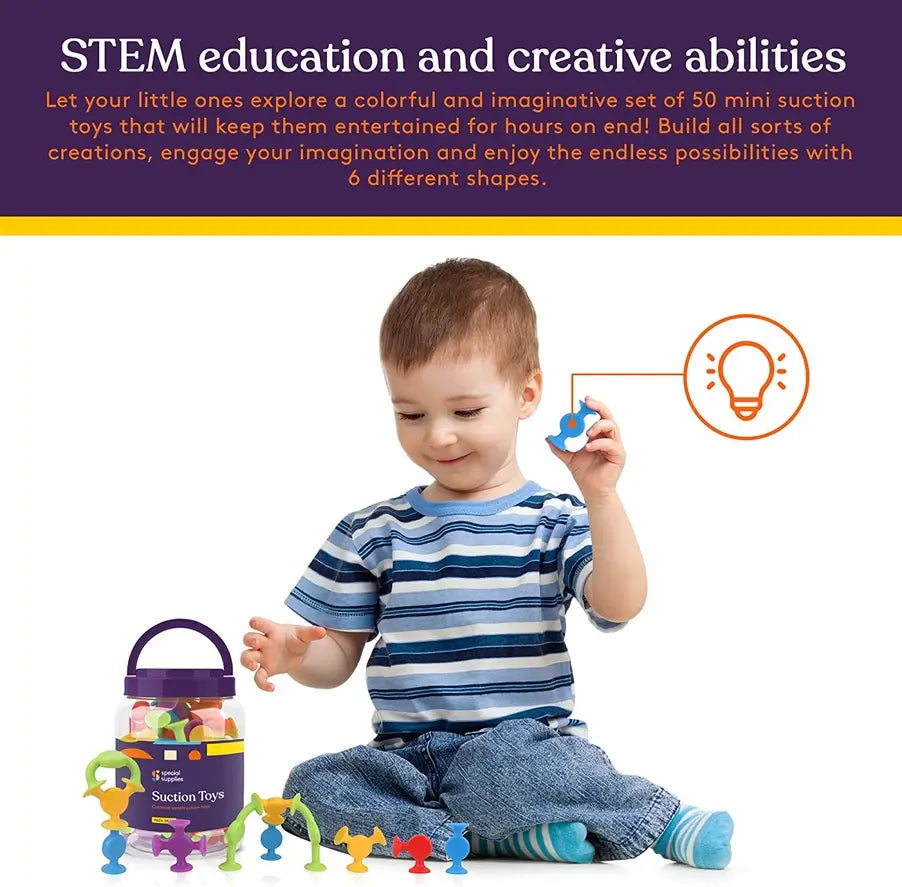 A child holds up a blue piece of the Creative Construction Suction Toys set.