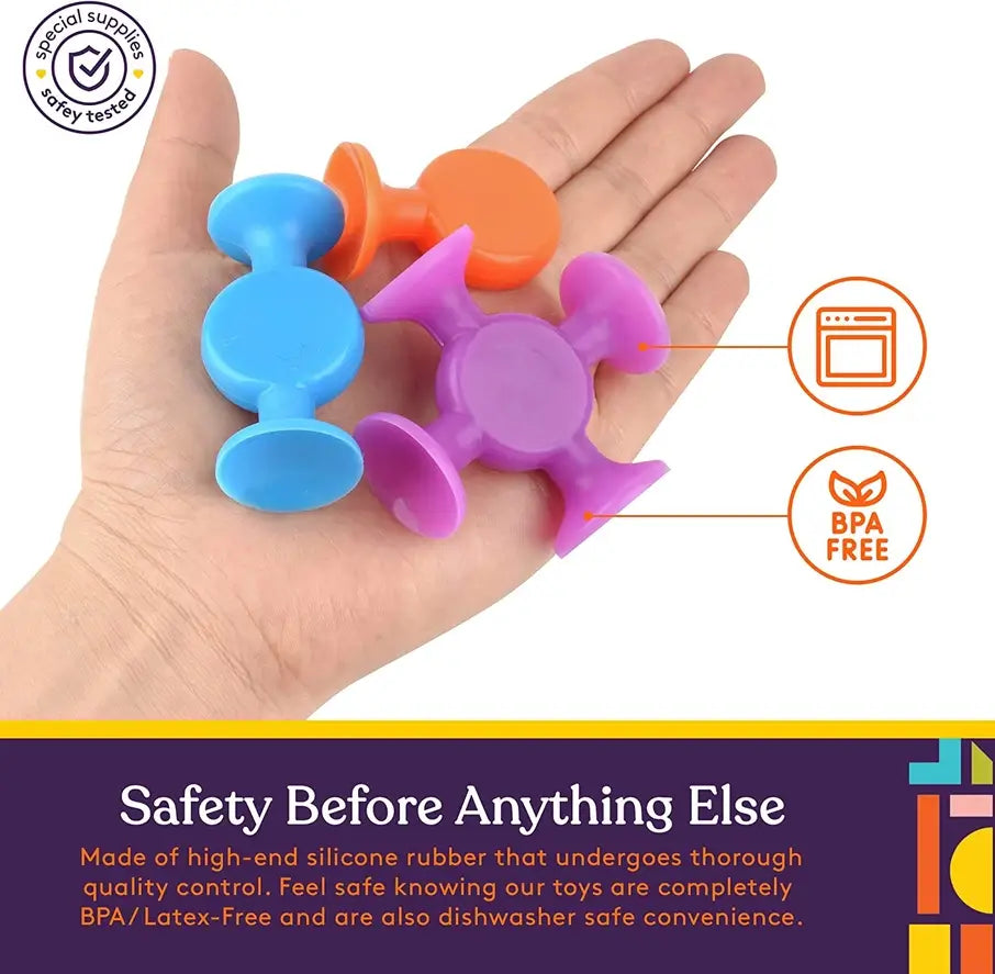 A hand holds three colorful pieces of the Creative Construction Suction Toys Set.