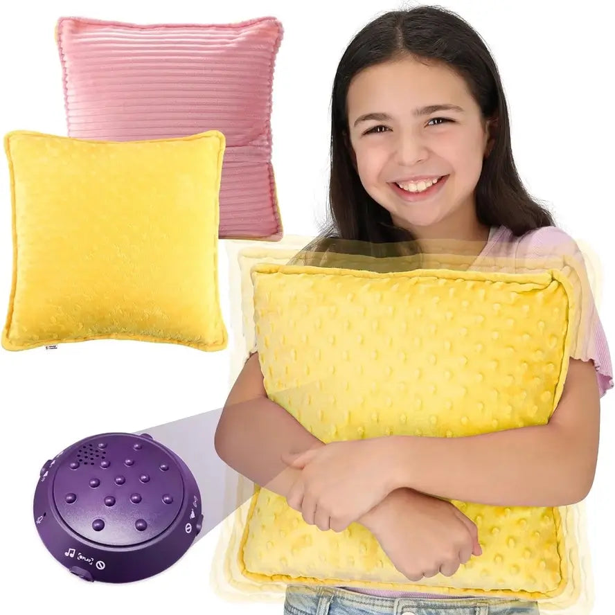 A child squeezes tight to the Dual Sided Vibrating Pillow in Pink & Yellow.